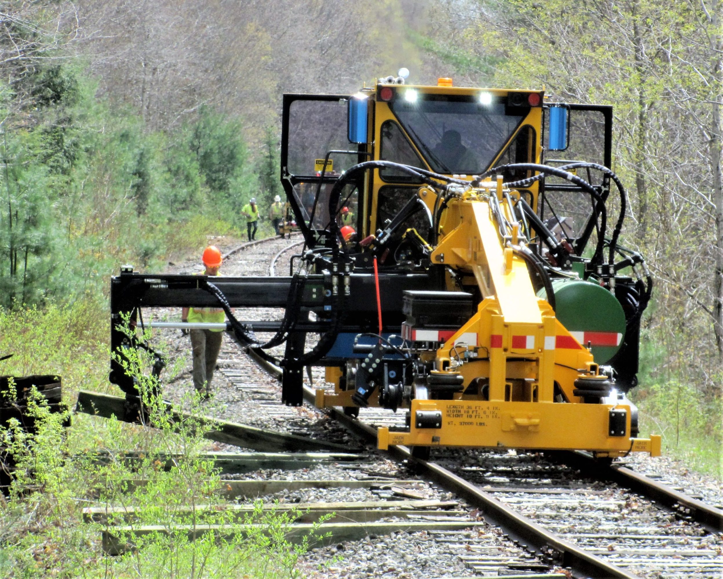 a train that is sitting in the grass