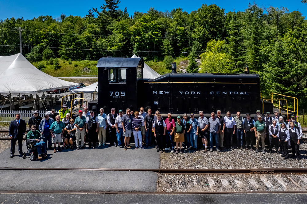 a group of people walking in front of a crowd