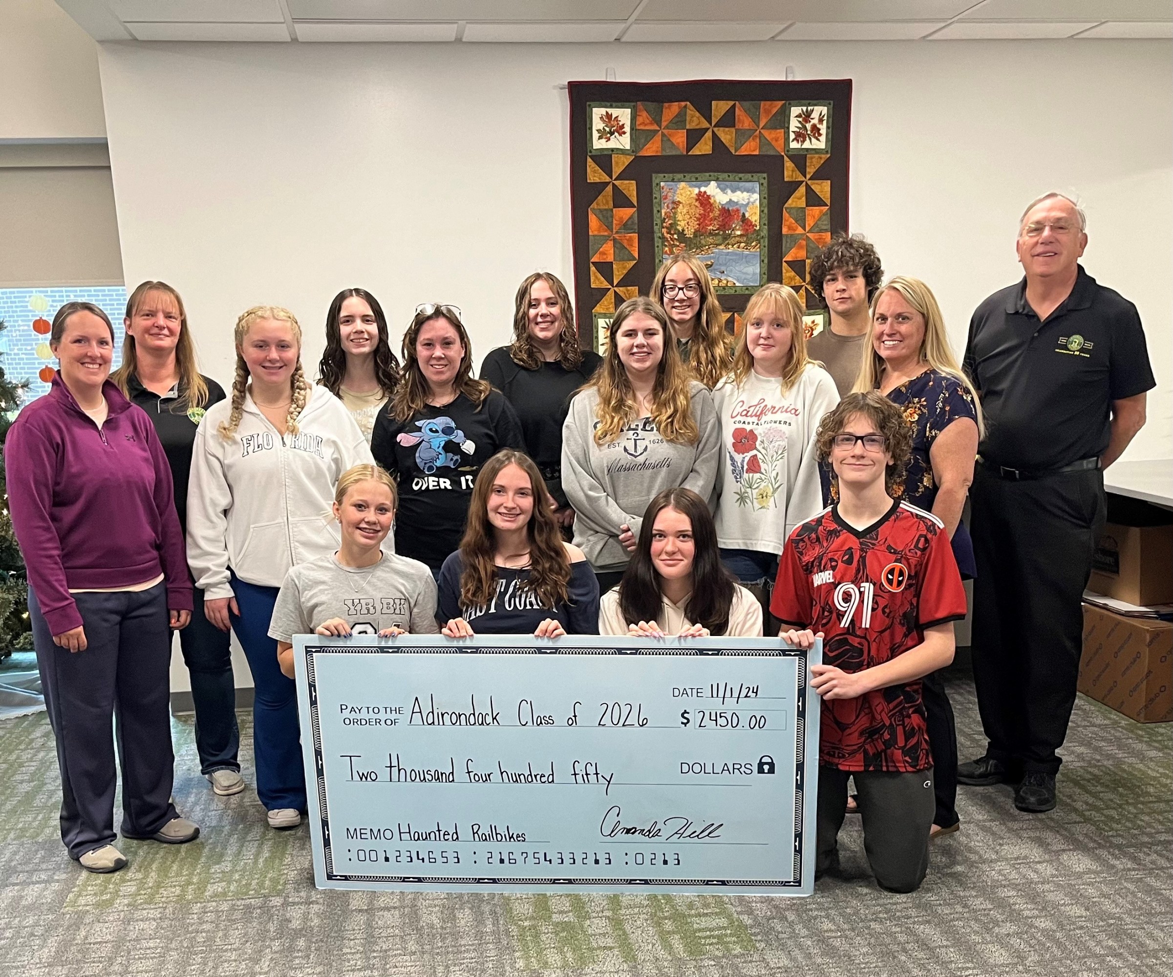 Adirondack Railroad presented 2 checks, one to the class of 2028 and one to the class of 2026 at the Adirondack Central School. Each class received $2,450.